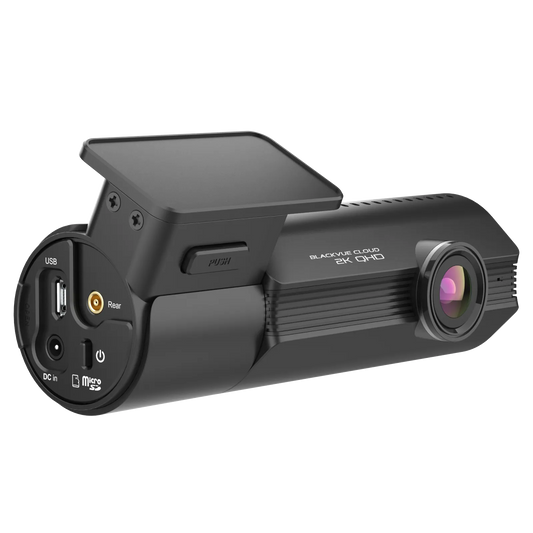 Black dash camera with multiple ports on a white background